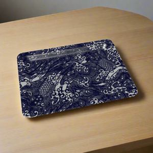 Rectangular tray with rounded corners, featuring a detailed dark blue and white koi fish design, placed on a light wood table.