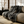 Woven blanket featuring a dynamic Japanese wave motif in black and white, with a fringe of black, white, and light blue threads.