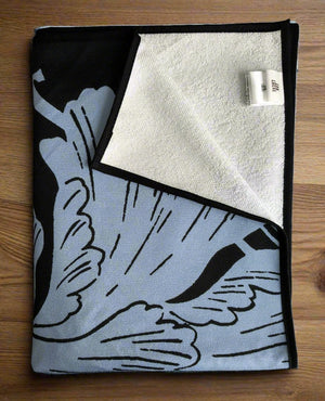 Microfiber and cotton terry towel with a black and light blue peony floral pattern.
