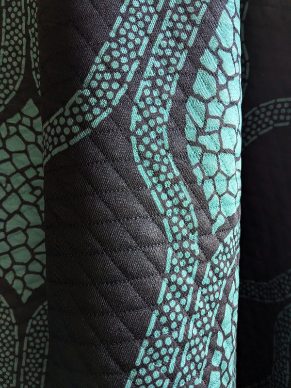 Rhythm Teal/Black Quilted Throw Blanket