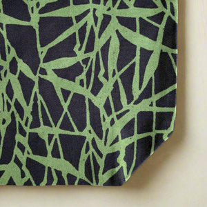Green and black Everyday Tote Bag with a geometric bamboo-inspired pattern. Made from organic cotton canvas.