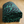 Quilted jersey throw blanket featuring a bold fern design in black and green. Soft and double-layered with a Sherpa fleece back.