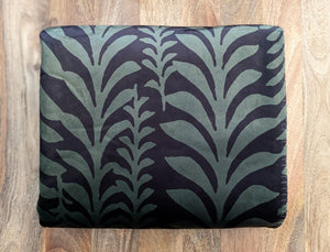 Sherpa blanket folded on a wooden table