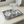 Rectangular tray featuring a dark green stylized motif against a dense dark blue geometric repeat pattern on a white background.