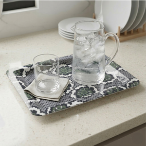 Rectangular tray featuring a dark green stylized motif against a dense dark blue geometric repeat pattern on a white background.