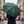 Dark green umbrella featuring a lighter green katagami-inspired peony motif.