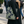 Dark blue tote bag with a light olive green botanical pattern featuring stylized fan-like leaves and intertwining vines.