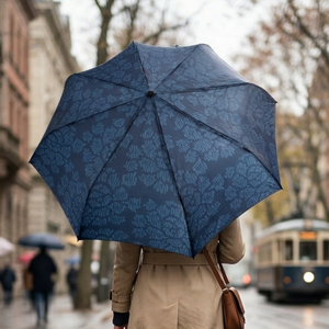 Dark blue umbrella featuring a lighter blue stylized peony (botan) pattern.