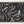 Woven blanket with a stylized Japanese nami (wave) pattern in black, pale blue, and white, finished with multi-colored fringe.